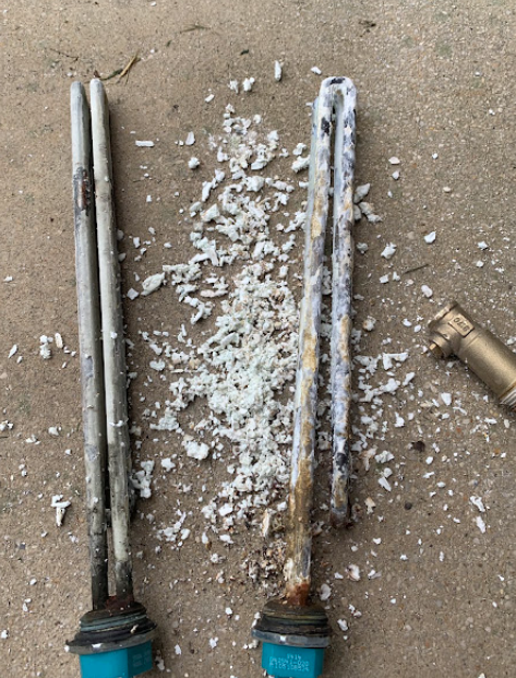 Corroded water heater anode rods — mineral buildup
